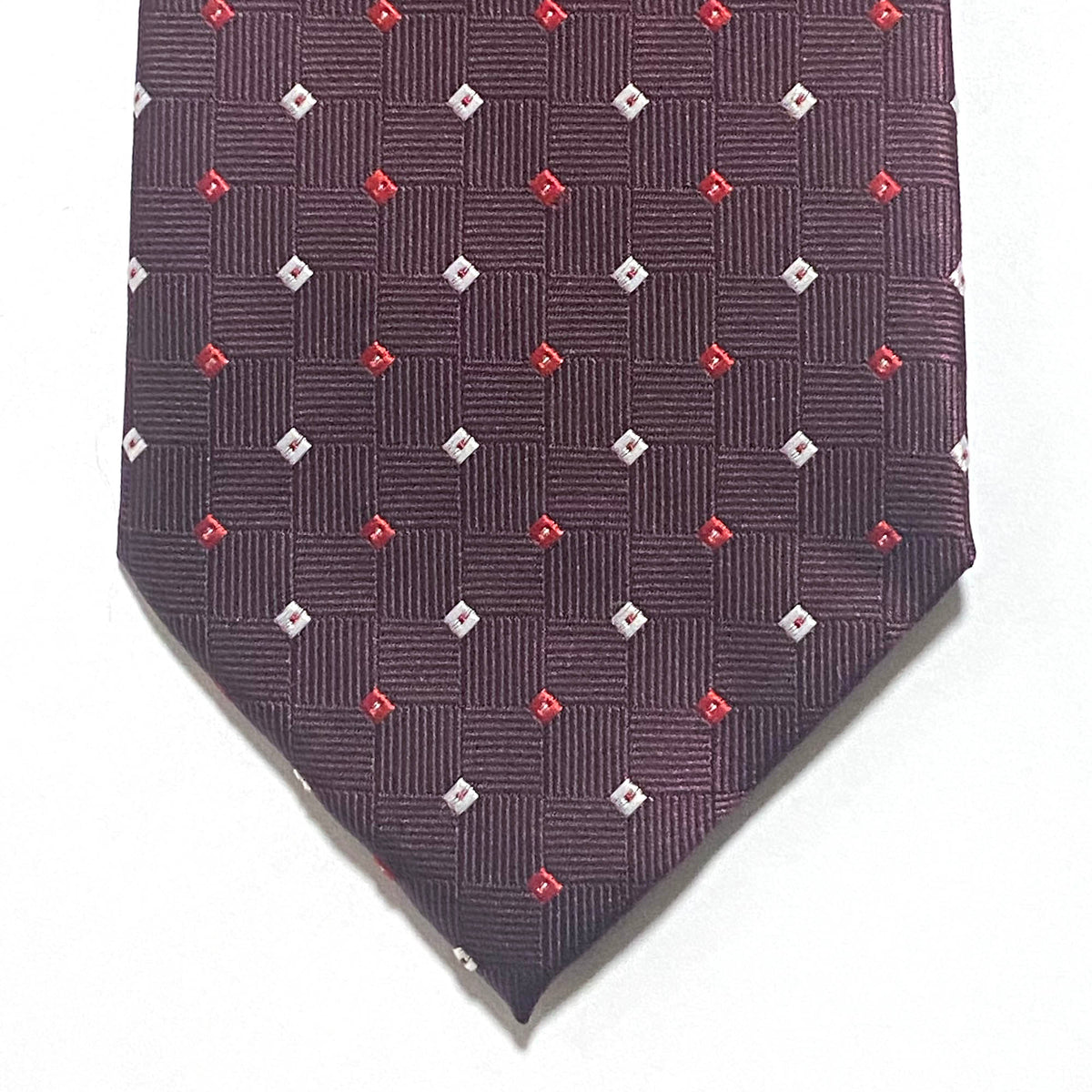 Burgundy small square tie White and Red featuring small white and red squares in a jacquard pattern by Orotie.