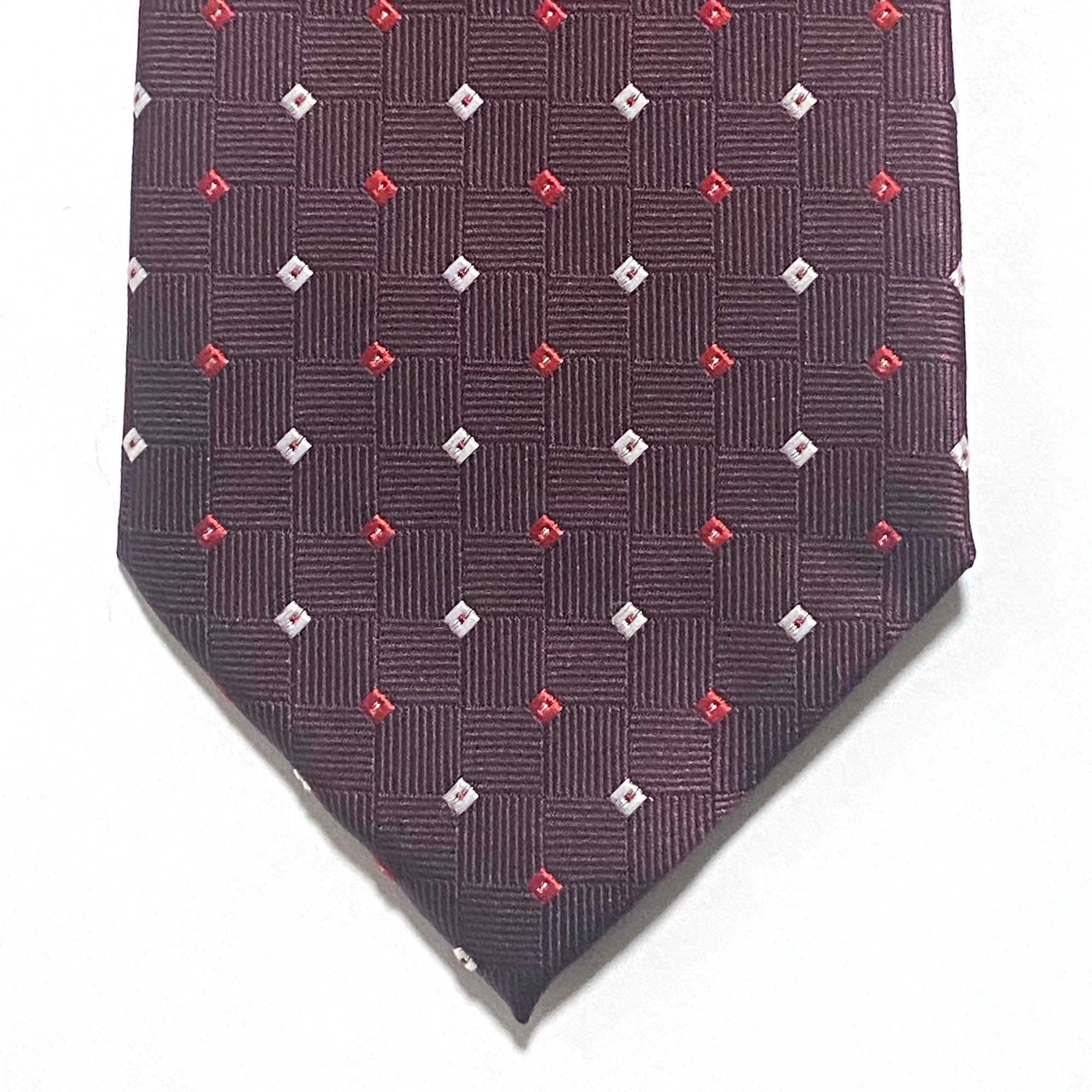 Burgundy small square tie White and Red featuring small white and red squares in a jacquard pattern by Orotie.
