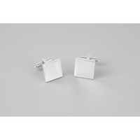 A pair of silver plain square thin cufflinks with T-bar back closure on a grey background.