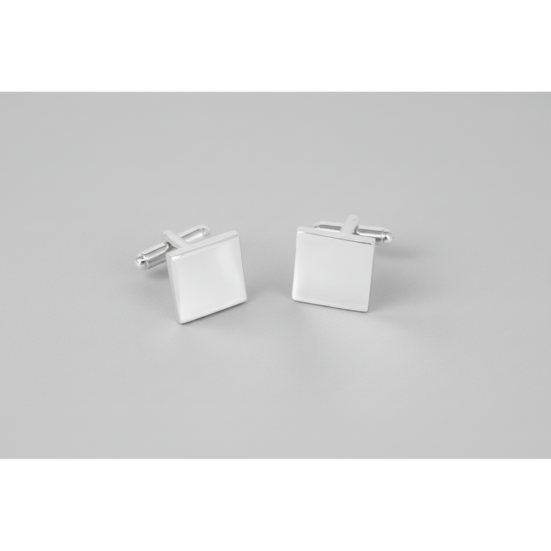 A pair of silver plain square thin cufflinks with T-bar back closure on a grey background.