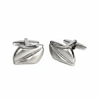 Pair of silver cufflinks on a white background