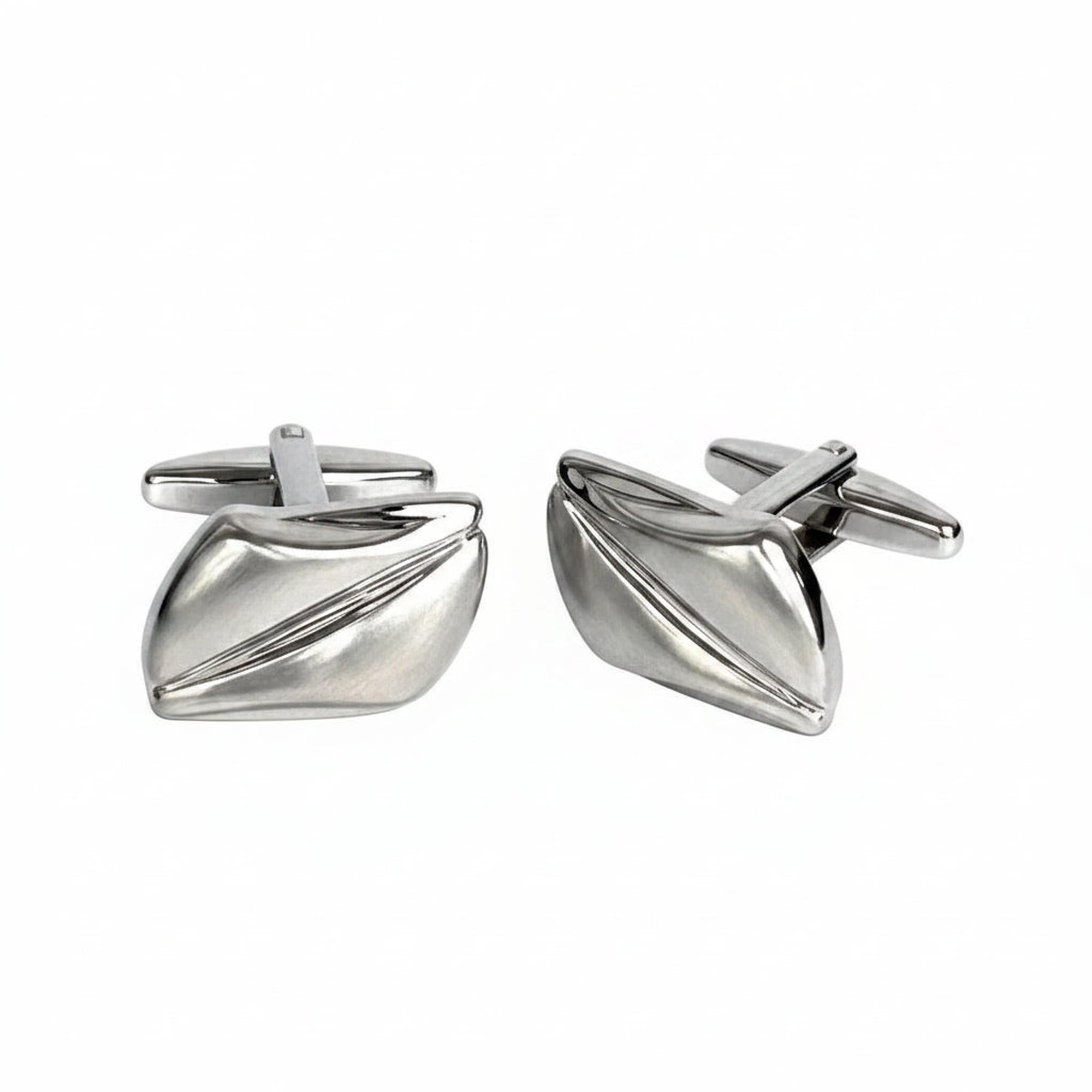 Pair of silver cufflinks on a white background
