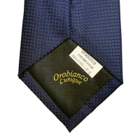 Navy blue tie with a visible brand label on a white background