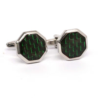 Hexagonal cufflinks with green and black pattern on a white background