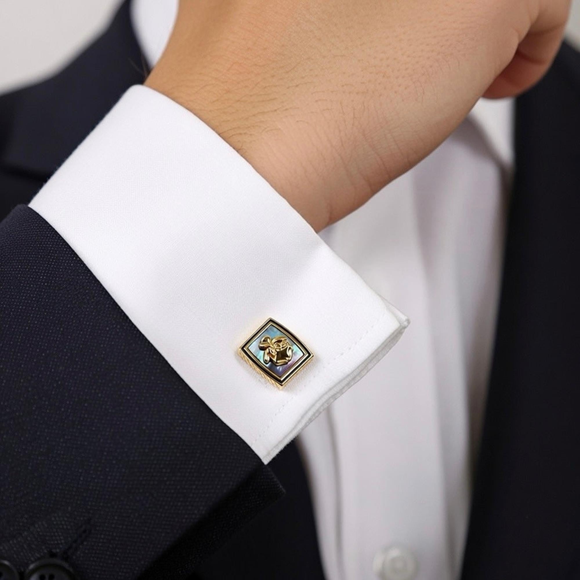 Premium cufflinks inspired by Vanda Miss Joaquim worn on a white shirt cuff, elegant design for modern gentlemen.