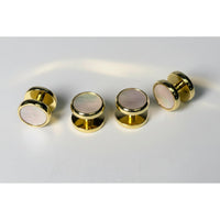 A set of gold-tone ear plugs with round iridescent mother-of-pearl inlays, shown both front and back on a light gray background.