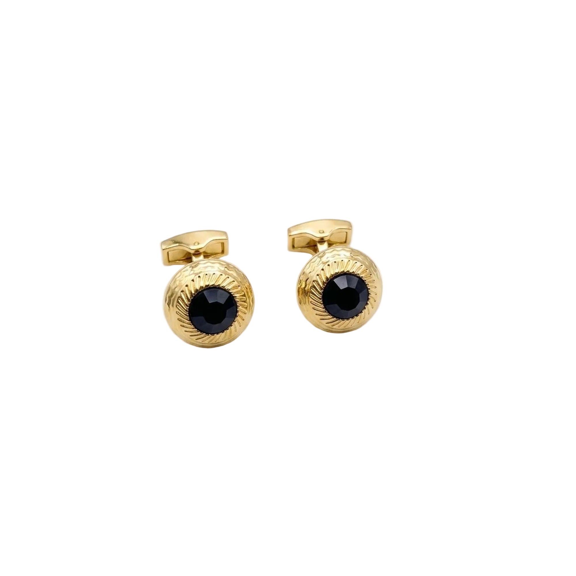 A pair of gold cufflinks with textured circular faces and a central black faceted gemstone, displayed on a clean white background.