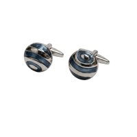 Pair of silver and blue striped cufflinks on a light gray background