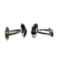 Pair of silver cufflinks on a white background