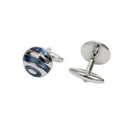 Pair of silver cufflinks with blue accents on a white background