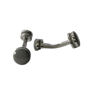 A pair of silver-toned metal belly button rings with dark gray circular cufflink