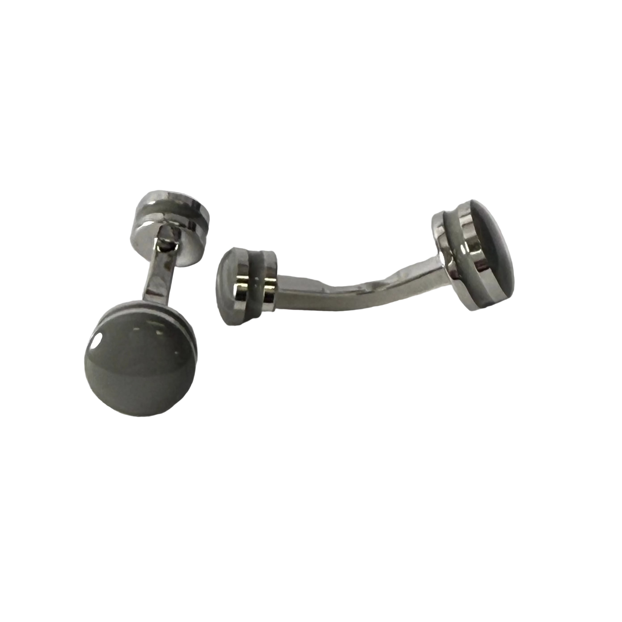 A pair of silver-toned metal belly button rings with dark gray circular cufflink