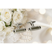 Premium men's cufflinks displayed alongside white roses and pearls, ideal for a sophisticated look.