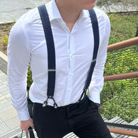 Man wearing Orobianco red dot suspender with a white shirt and black pants, stylish accessory for any occasion.
