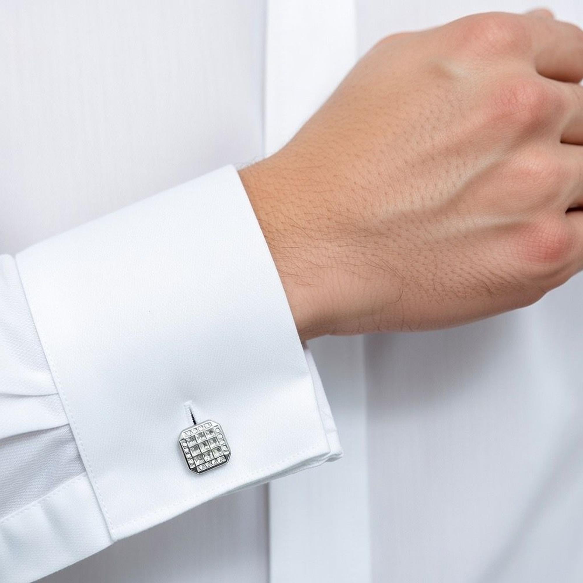 A close-up of a man's cuff wearing crystal square silver cufflinks, highlighting their elegant design and sparkle.